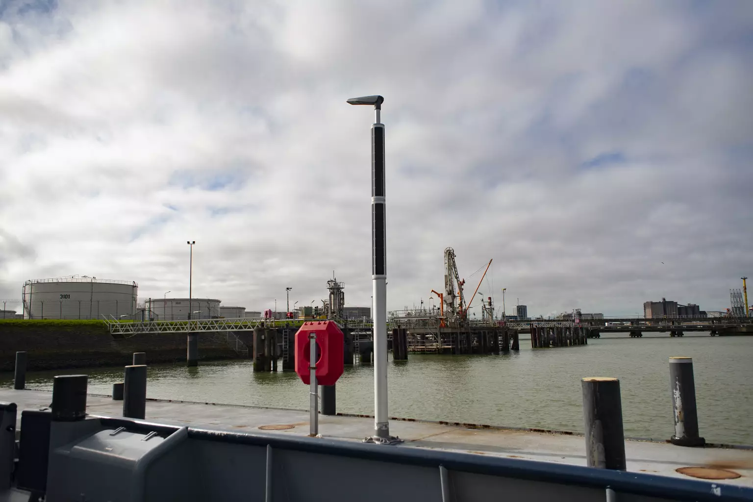 Industrial solar lighting with harbor in background