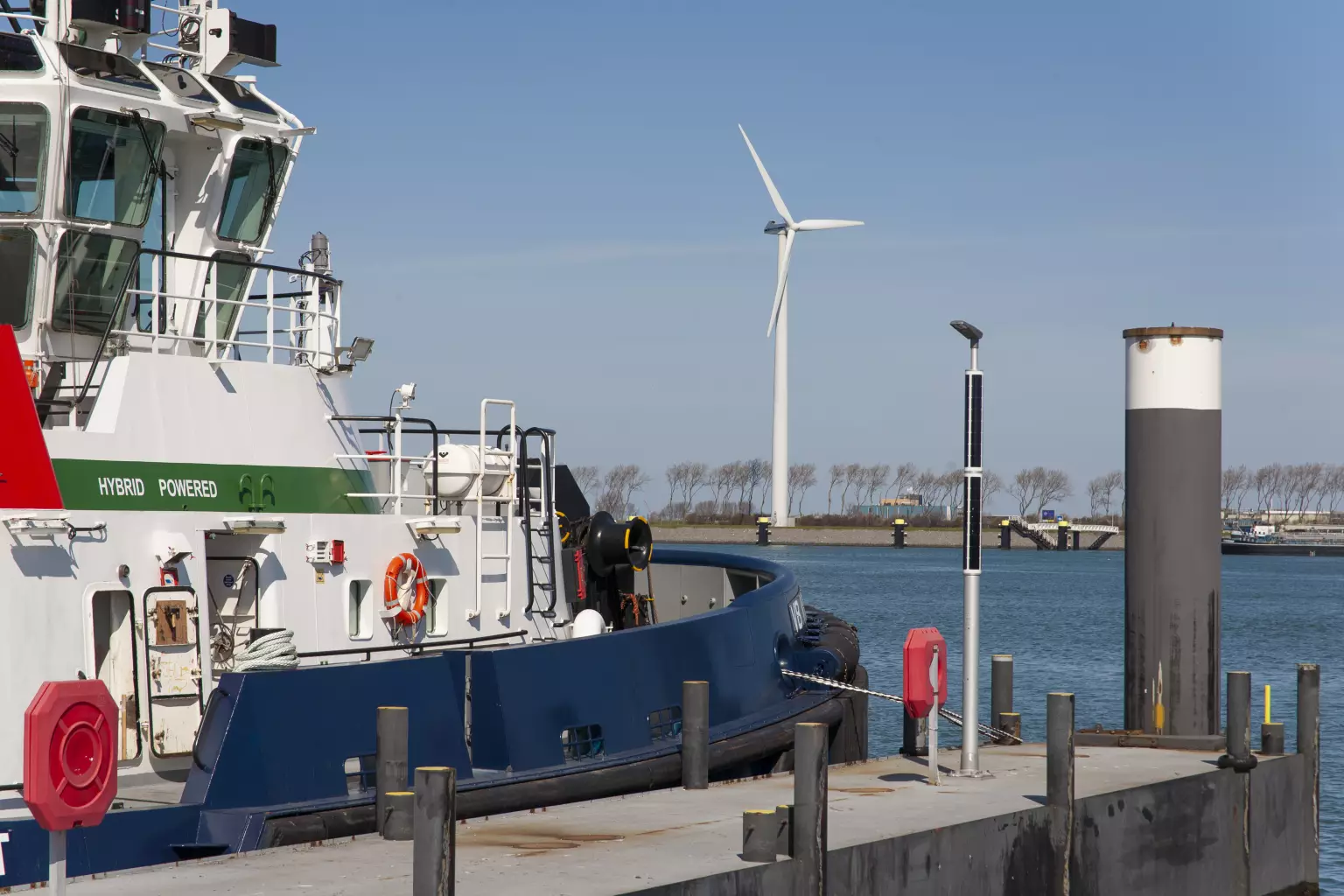 Soluxio solar industrial light pole next to boat